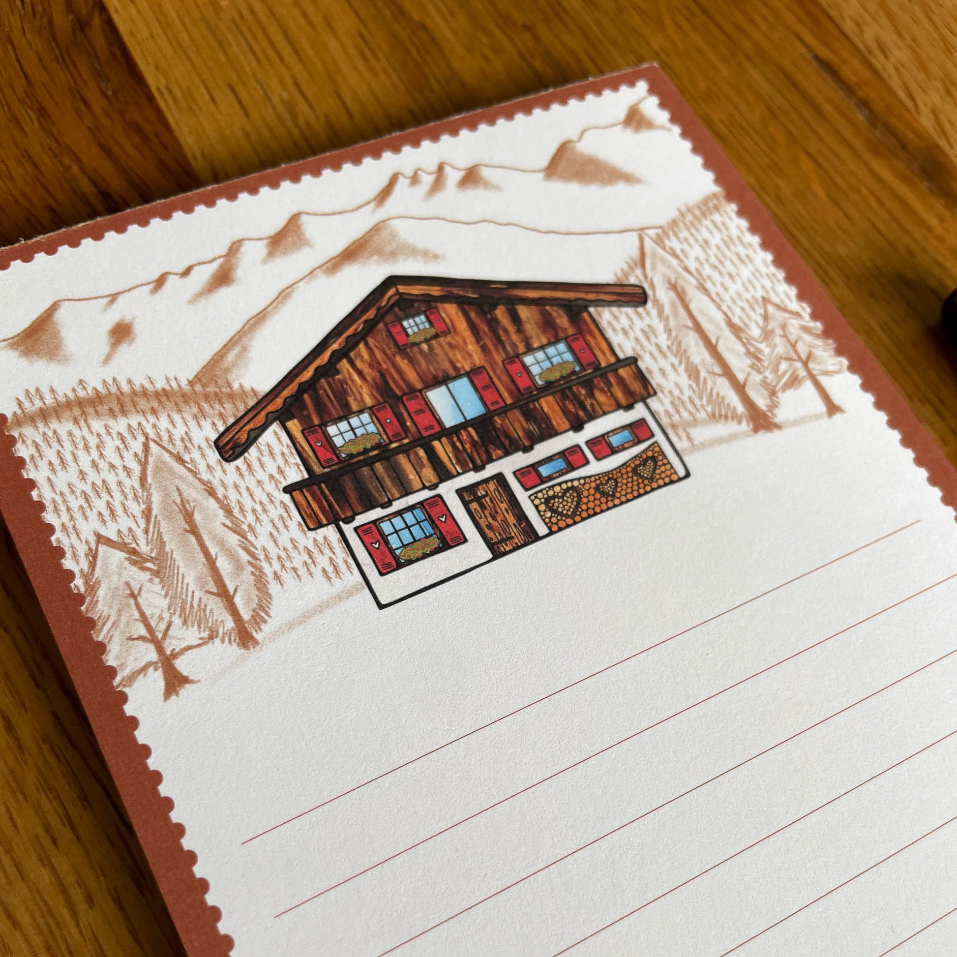 DL Note pad with 50 pages per pad, showcasing an adorable Swiss chalet against a backdrop of stunning Swiss Alps