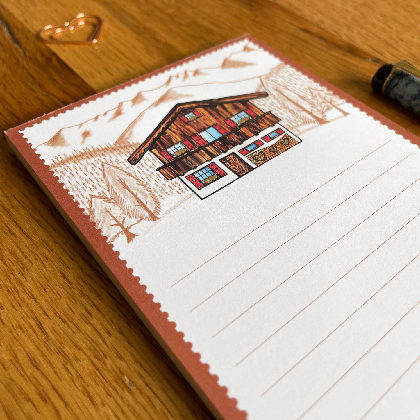 Experience the charm of Switzerland every time you use this lovely note pad, featuring a captivating illustration of a Swiss chalet