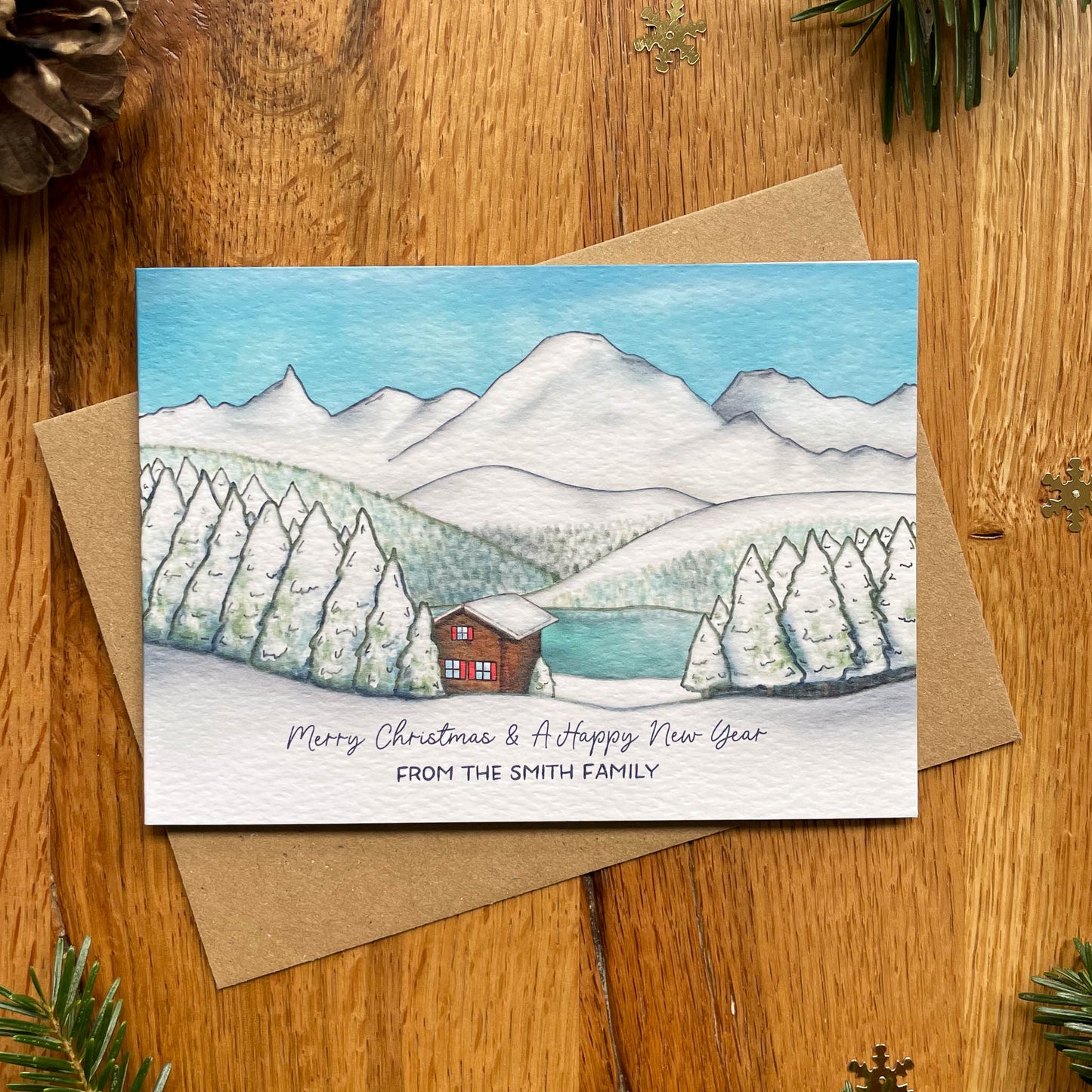 Set of 25 Personalised Family Christmas Card with Snowy Mountain Scene, Alpine Lake & Mountain Cabin