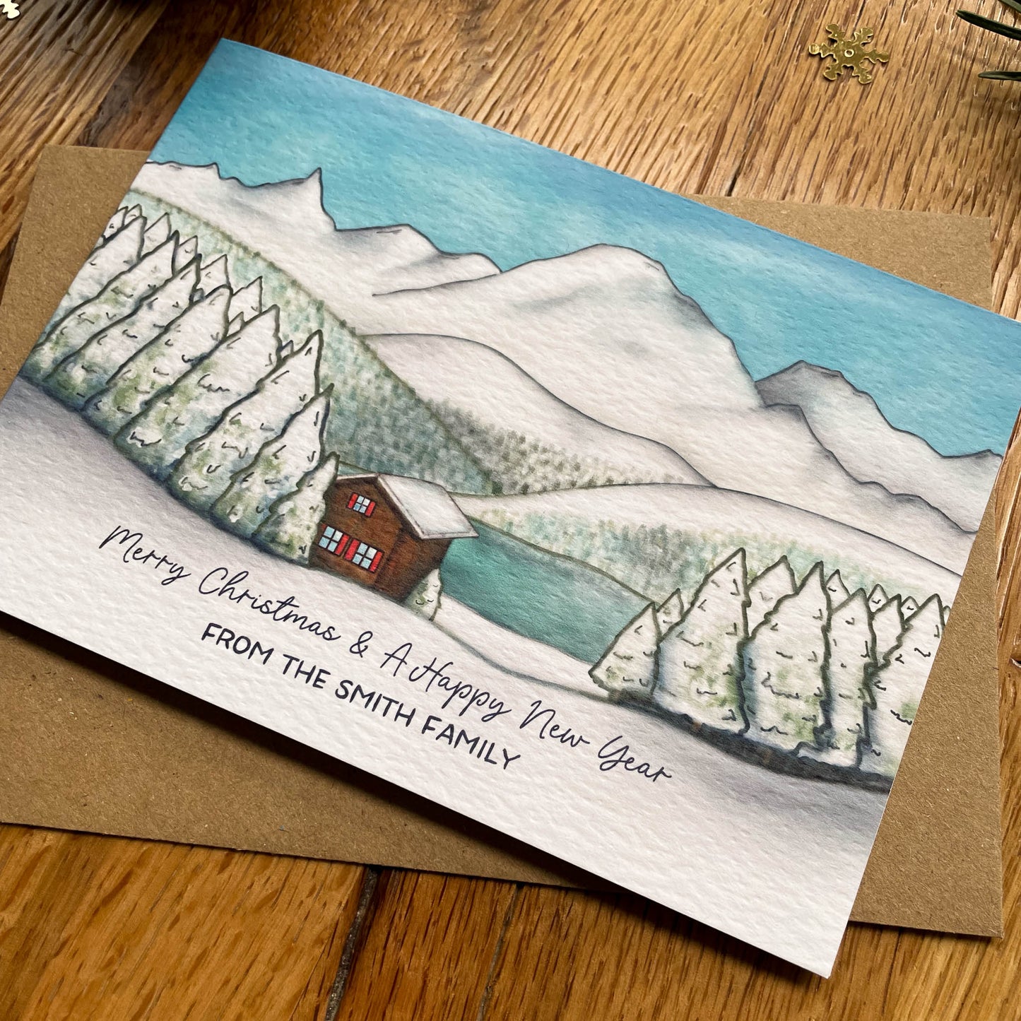 Set of 25 Personalised Family Christmas Card with Snowy Mountain Scene, Alpine Lake & Mountain Cabin