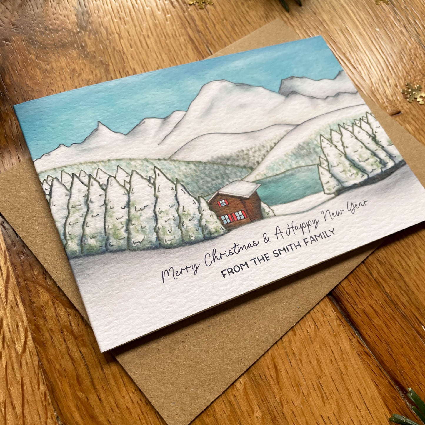 Set of 25 Personalised Family Christmas Card with Snowy Mountain Scene, Alpine Lake & Mountain Cabin