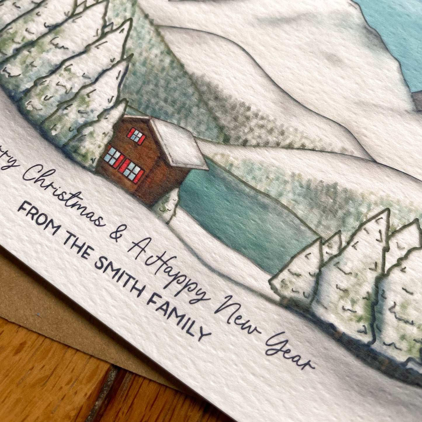 Set of 25 Personalised Family Christmas Card with Snowy Mountain Scene, Alpine Lake & Mountain Cabin