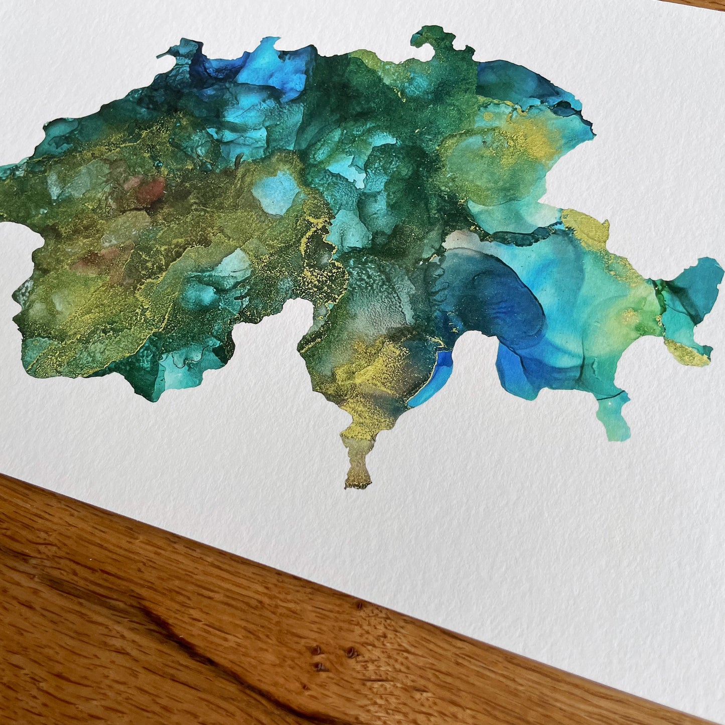  Stay connected to your roots with this Swiss-inspired artwork: A Giclee Print of an Abstract Ink Painting in the Shape of Switzerland, a meaningful gift for expats in Switzerland.